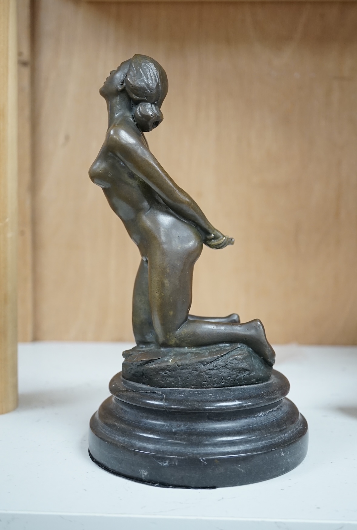 After Jean Patoue (1887 - 1936), a small bronze study of a bound nude lady, J.B. Deposse foundry mark, 21cm. Condition - base has crack around the entire diameter, possibly restored.